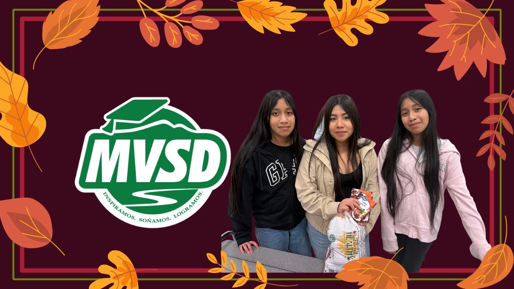 photo of students by the district logo